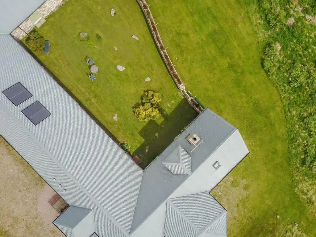 an overhead view of a white building with a yard at 4 Bed in Grantown-on-Spey CA383 in Aitnoch