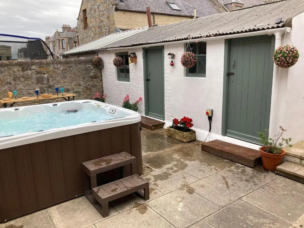 a hot tub in the backyard of a house at 3 Bed in Buckie 89824 in Buckie