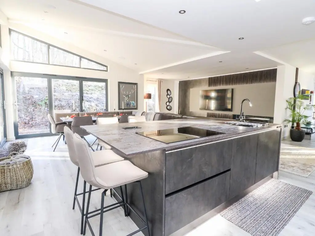 a kitchen with a large island with a sink at Heilan Roo in Pitlochry