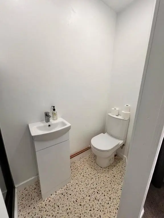 a bathroom with a toilet and a sink at Shared House in Inverness in Inverness