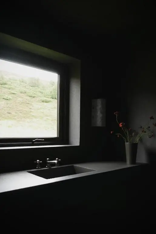 a bathroom with a sink and a window at Laggan Cottage - Charming home along River Gairn with unique panoramic room in Ballater