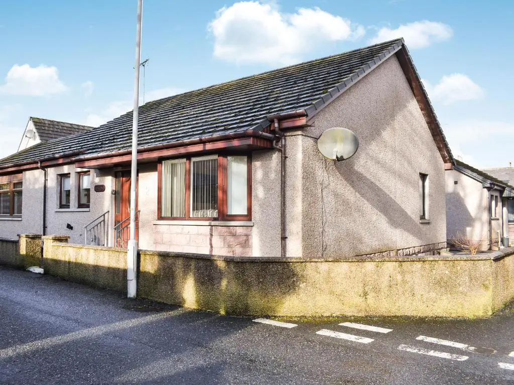 a house that is sitting on the side of a street at Rycon in Turriff