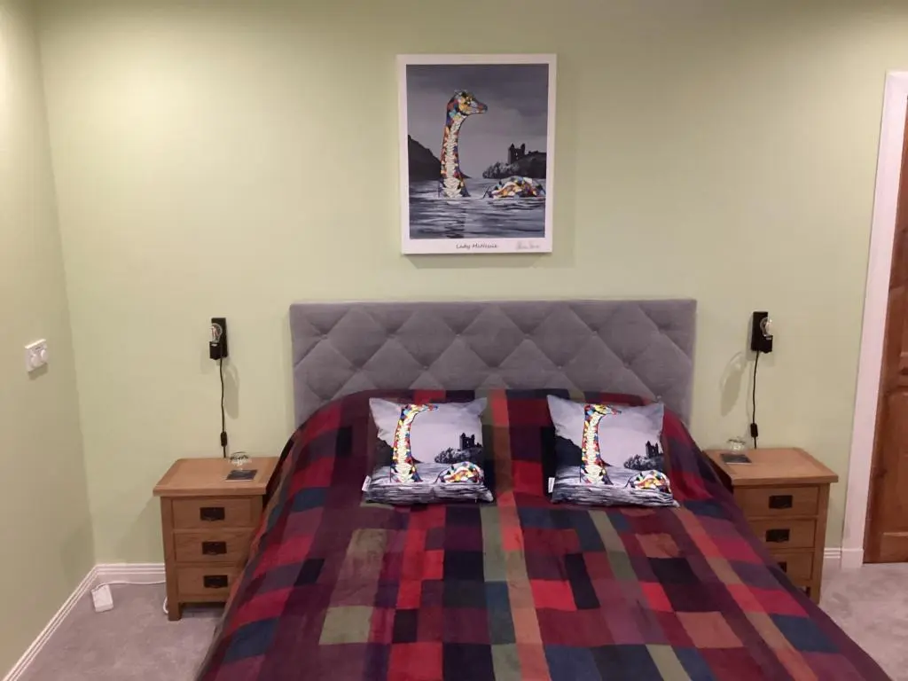 a bedroom with a bed with two pillows on it at Taigh Sealladh F\u00e8idh B&B in Fort Augustus