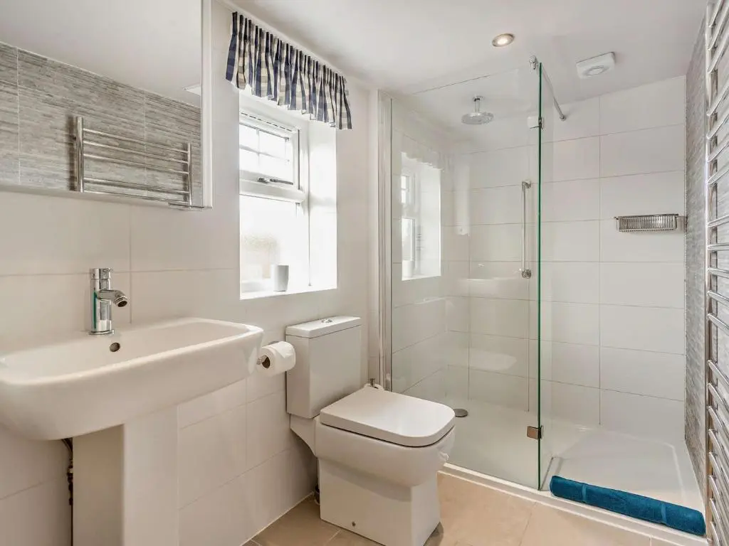 a bathroom with a toilet and a sink and a shower at 1 Bed in Elgin 32129 in Burghead