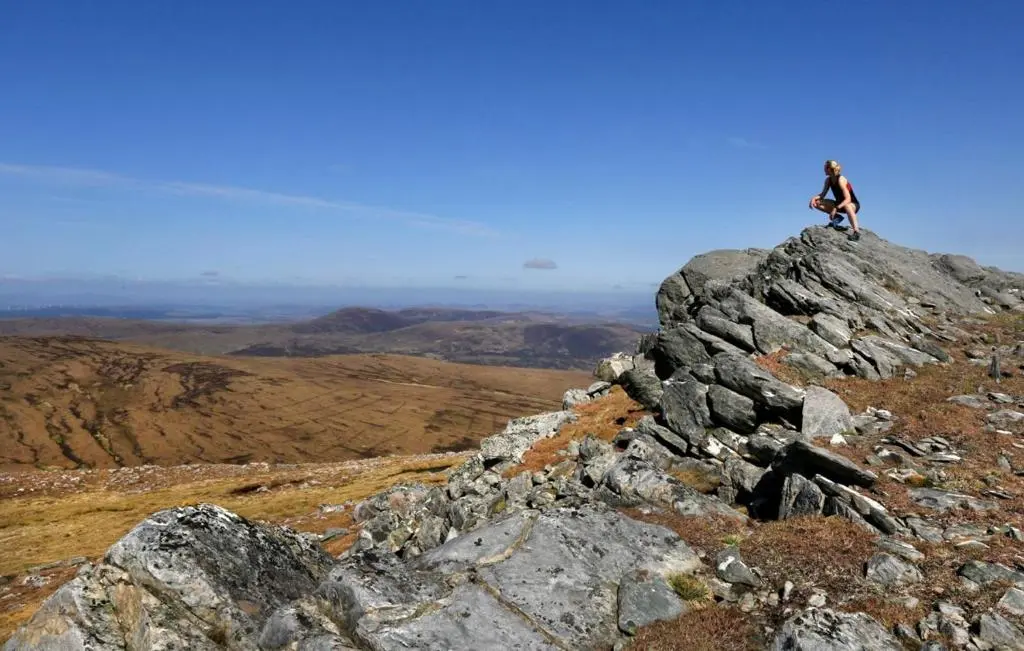 a person standing on top of a mountain at Caledonian Lodge in Croick