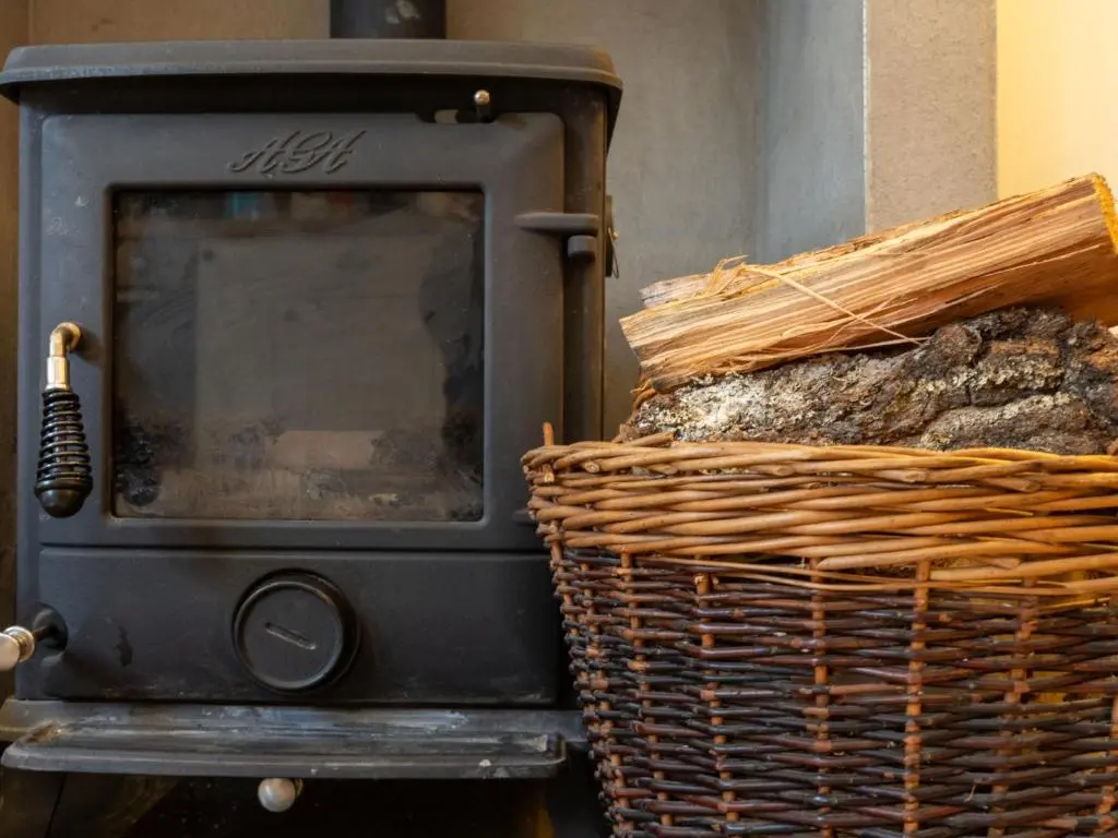 a stove with a basket of bread next to it at Holiday Home Railway House by Interhome in Aviemore
