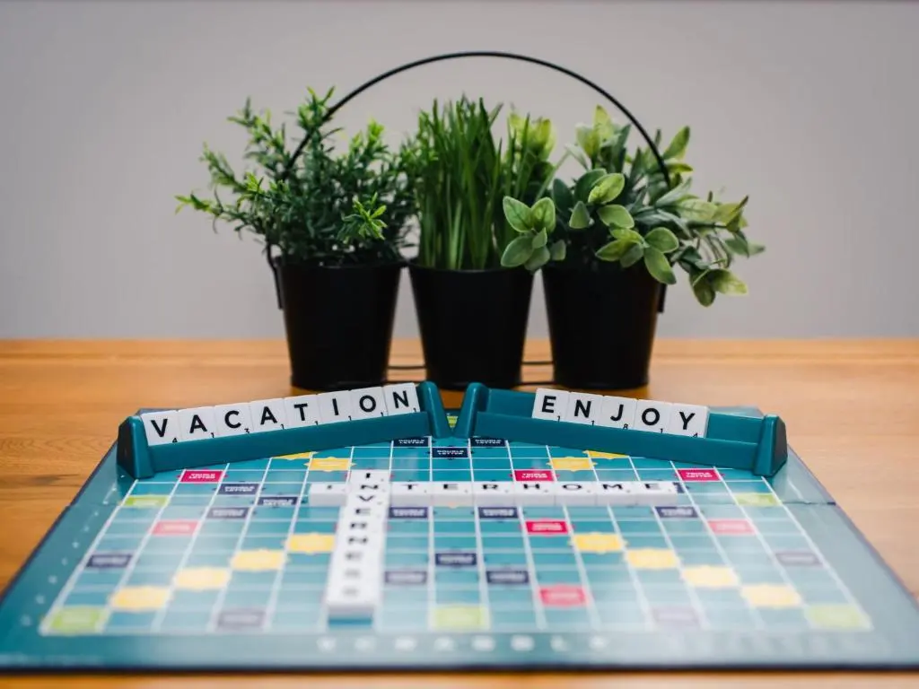 a game board on a table with potted plants at Apartment Number 39 by Interhome in Inverness