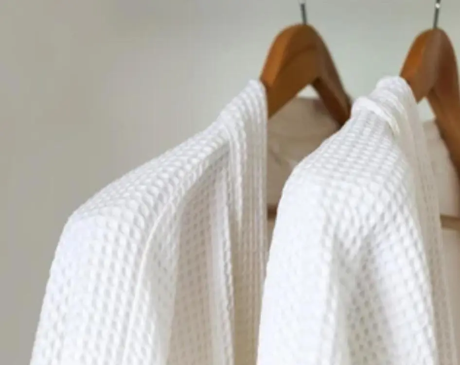 a group of white sweaters hanging on a rack at Eldon Lea in Strathpeffer