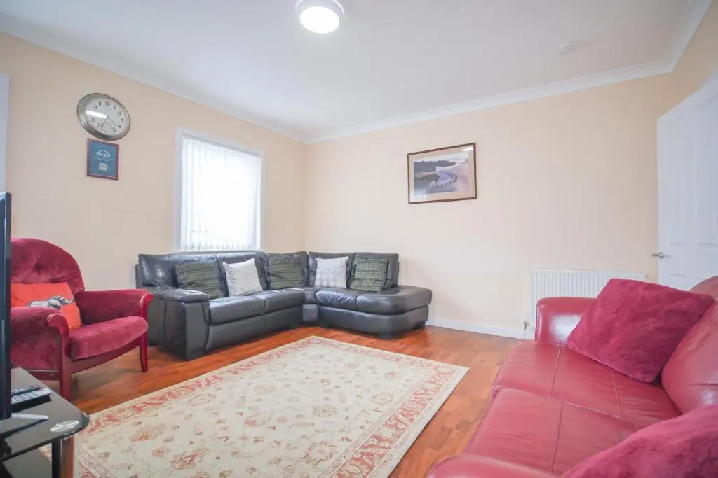 a living room with a couch and two chairs at Telford St 4 Bedroom House Inverness in Inverness