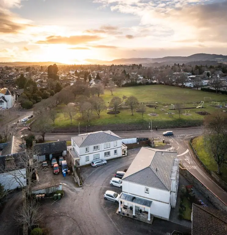an aerial view of a house with a parking lot at Apartment 91 in Inverness
