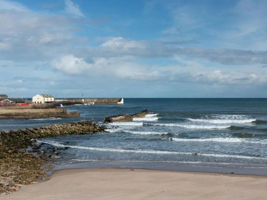 a view of the ocean with waves hitting the beach at Apartment Harbour Nights Deluxe 7C by Interhome in Lossiemouth