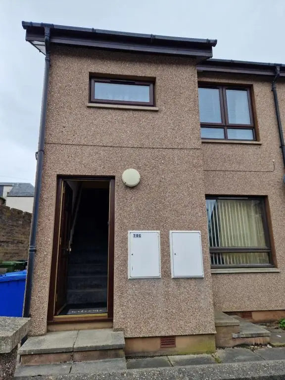 a building with two signs on the side of it at No 70G in Inverness
