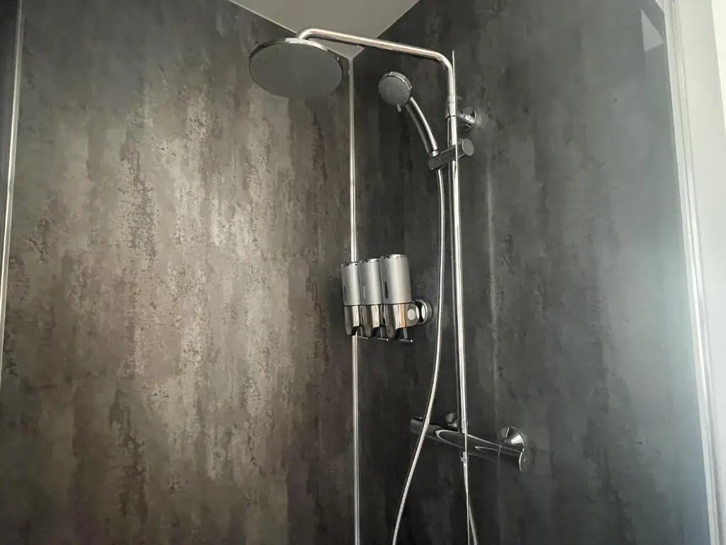 a bathroom with a shower with a shower head at 4 Guests - Inverness Highland Hideaway Nc500 in Inverness