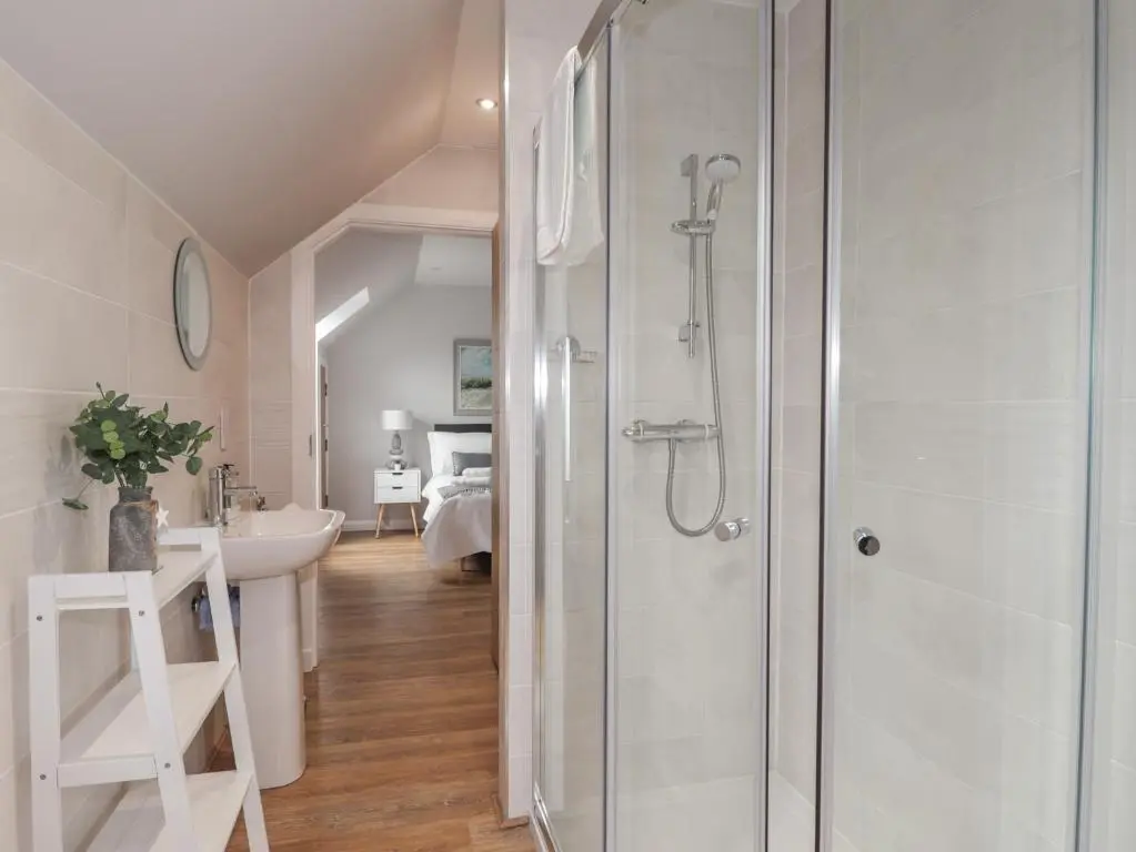 a bathroom with a shower and a sink at Spinnaker in Lossiemouth
