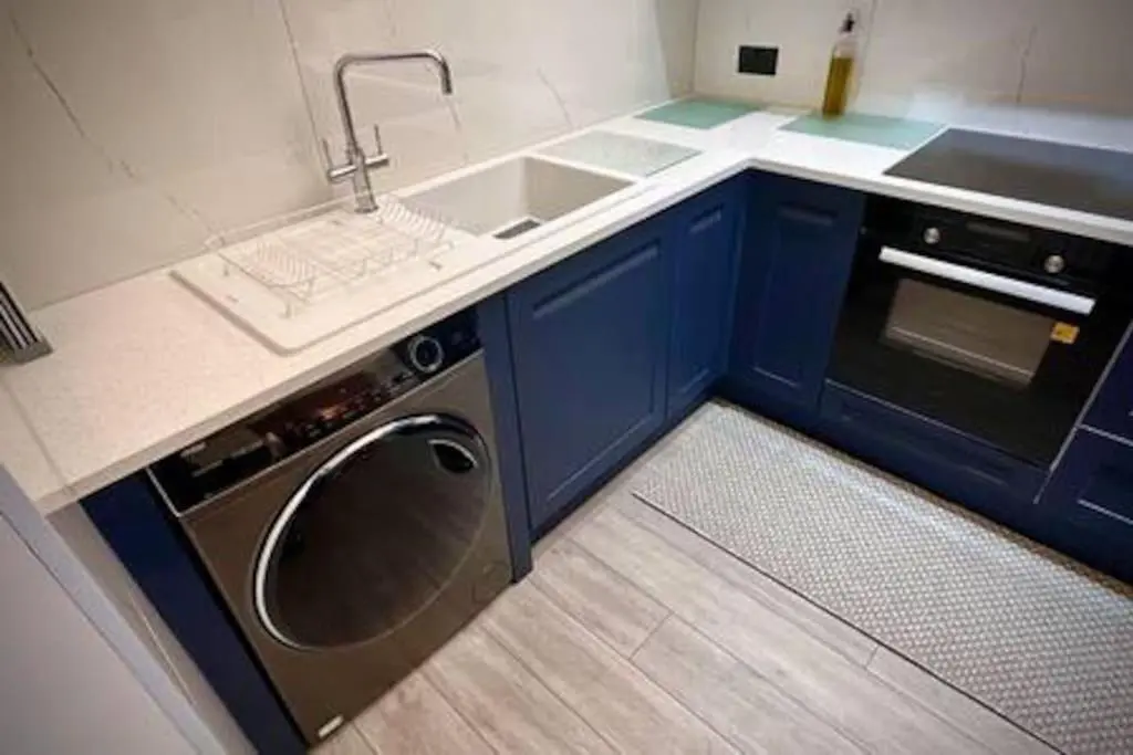 a small kitchen with a sink and a dishwasher at Treat Yourself To Luxury & Style in Inverness