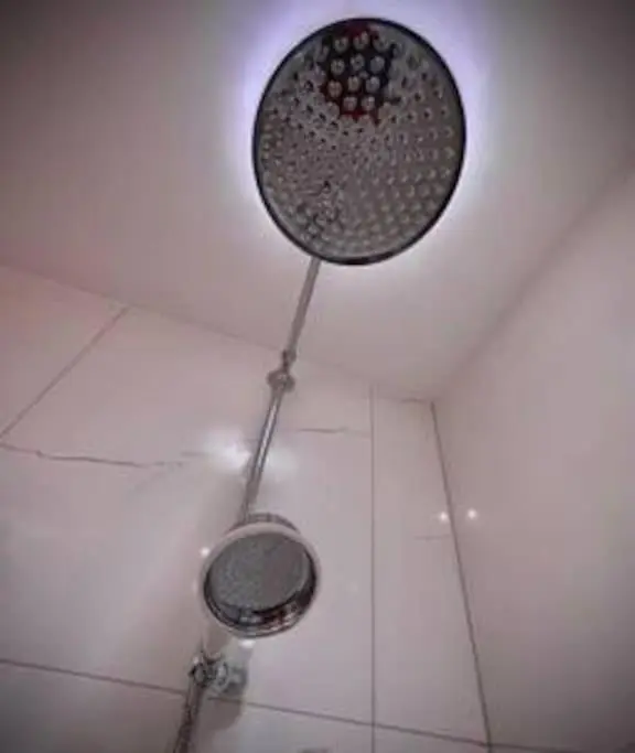 a shower head on the ceiling of a bathroom at Treat Yourself To Luxury & Style in Inverness