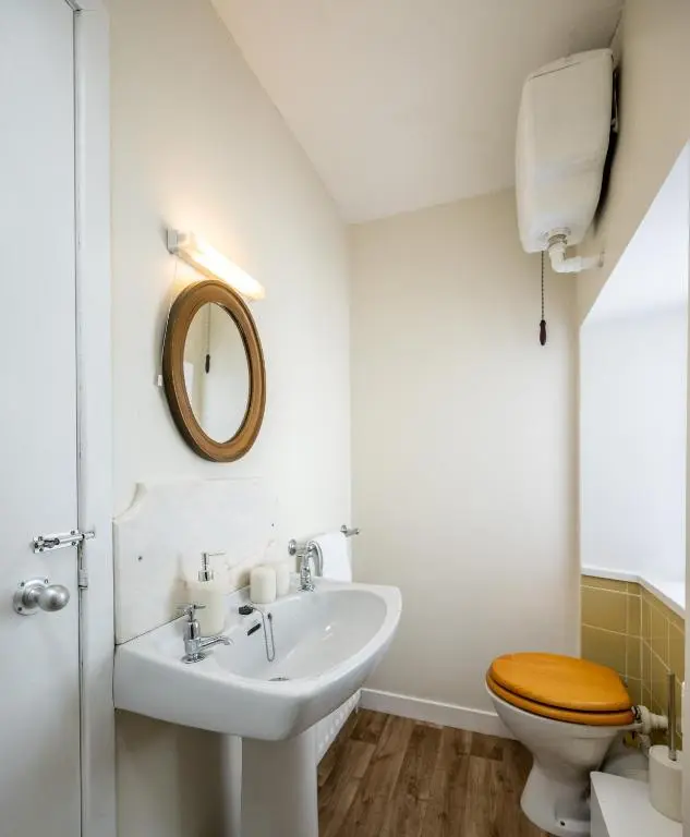 a bathroom with a sink and a toilet at 6 Shorehead, Portsoy in Portsoy