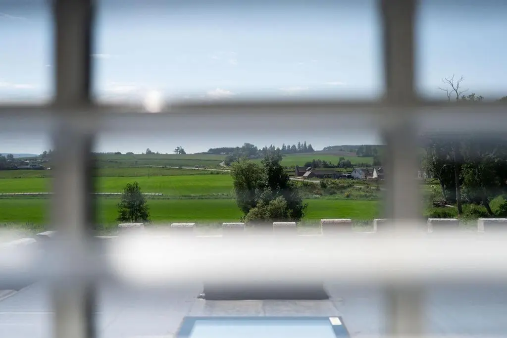 a view from a window with a view of a field at The Forbes Arms Hotel in Alford