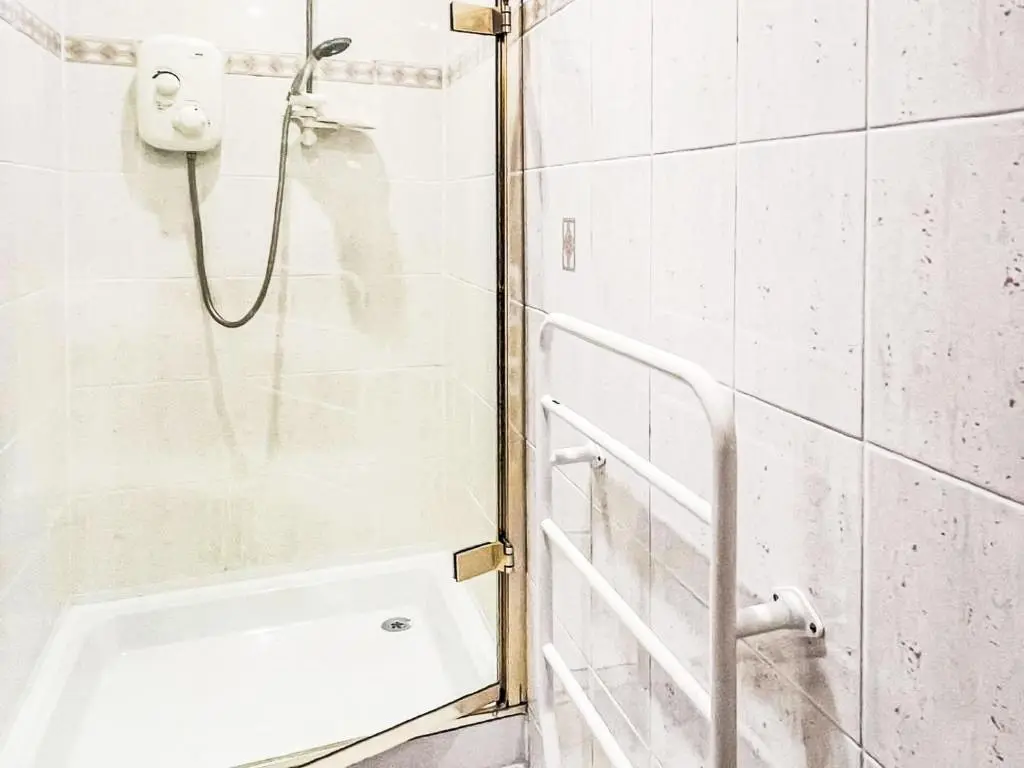 a shower with a glass door in a bathroom at Chalet Oich View by Interhome in Spean Bridge