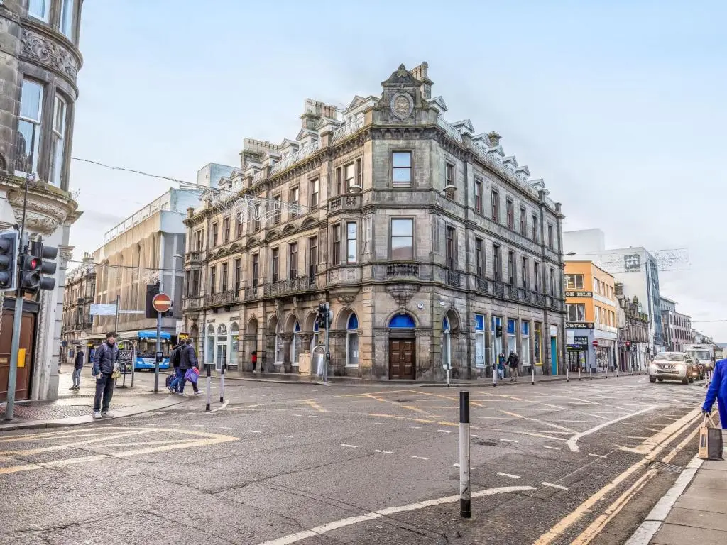 an old building on the corner of a city street at Holiday Home Kincraig by Interhome in Inverness