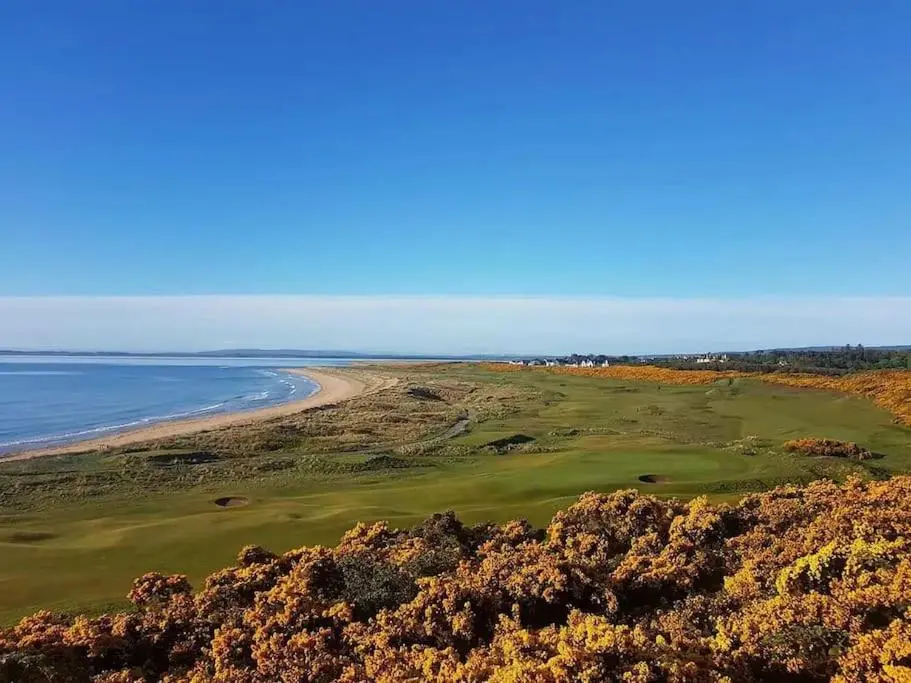 an aerial view of a golf course next to the ocean at Orcadia Sutherland Road Dornoch IV25 3SX in Dornoch