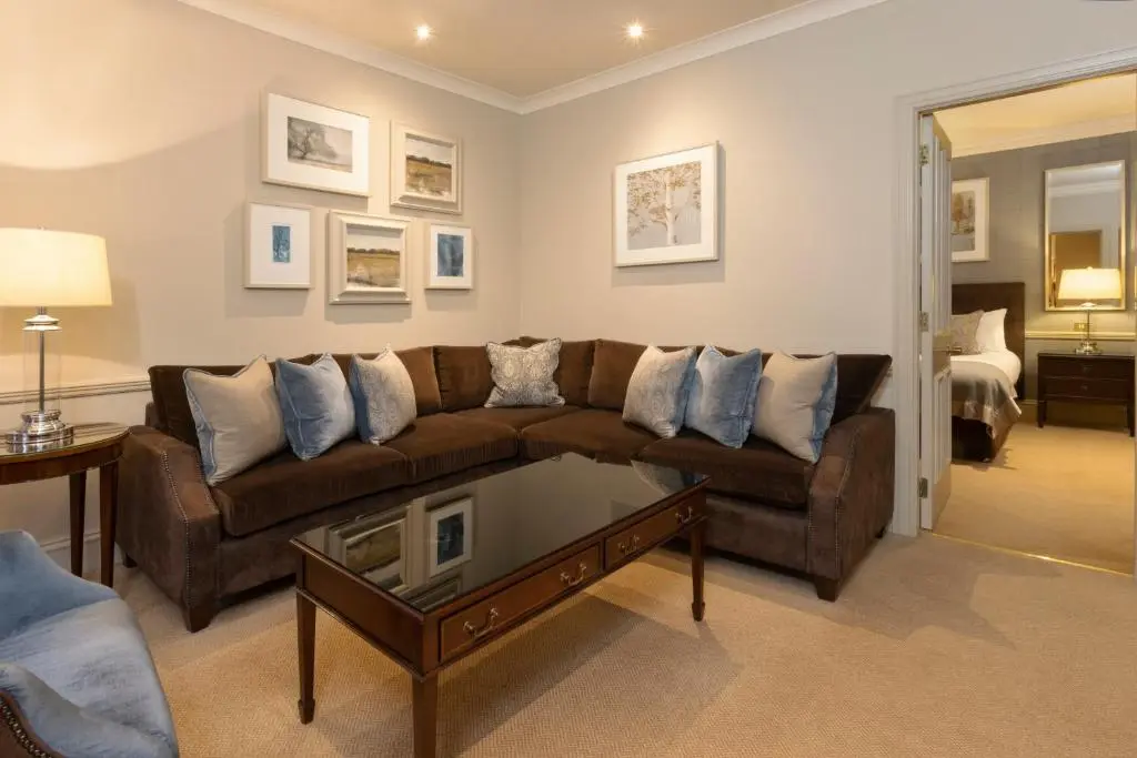a living room with a couch and a coffee table at Thainstone House in Inverurie