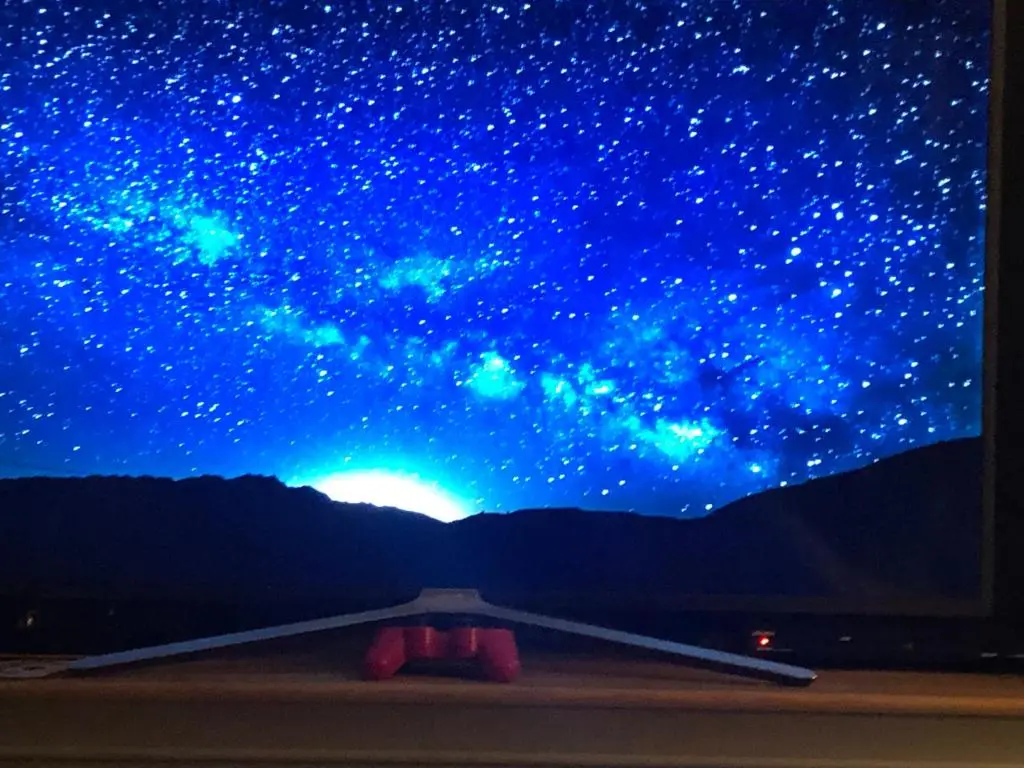 a view of a starry sky from a window at Retreat Hot Tub Highland Cabin in Inverness