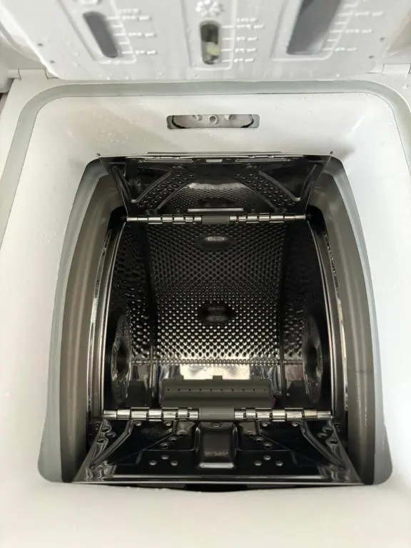 a white washing machine with its door open at Silversands Holiday Park in Lossiemouth