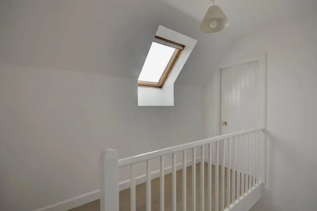 a room with a crib and a window at Wilsons, Golspie in Golspie