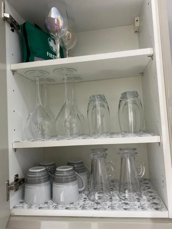a drawer filled with glass jars and other items at 39 Wells Street Apartment in Inverness