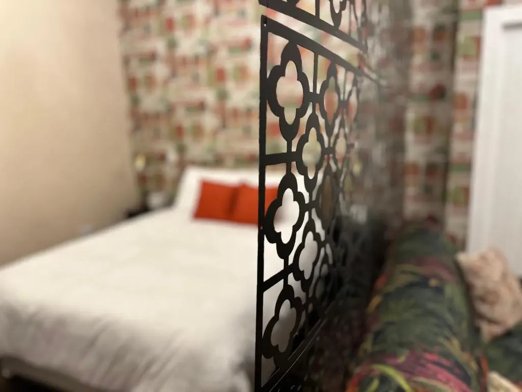 a bedroom with a bed with a black and white pattern at Inbhir Nis City Apartment in Inverness