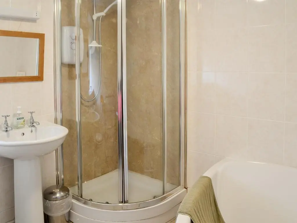 a bathroom with a shower and a sink at Dalvanie Mill - S4241 in Tulchan