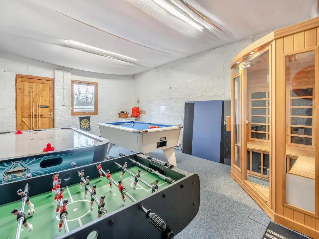 a room with a pool table and ping pong balls at Croftside House - S4401 in Inverdruie
