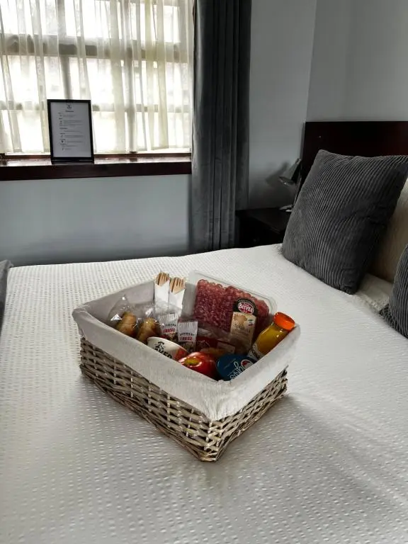 a basket of vegetables sitting on a bed at The Stag Hotel in Banchory