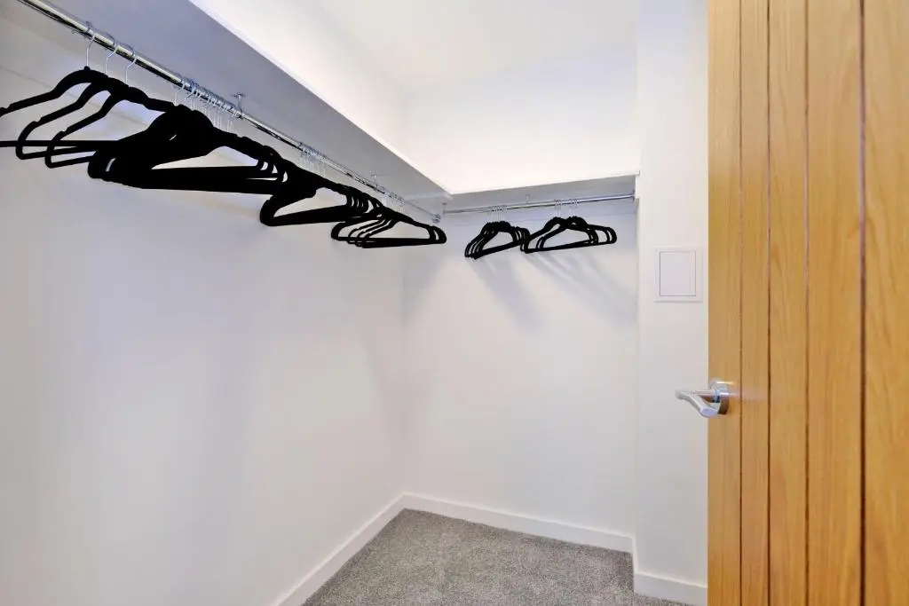 a pair of shoes on a shelf in a room at Contemporary Luxury Lodge, Aberdeen West in Blackburn