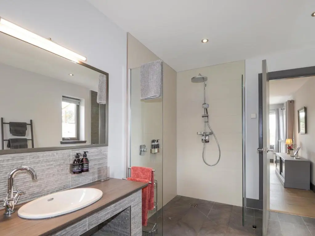 a bathroom with a sink and a shower at Ben Luna Lodge in Inverness