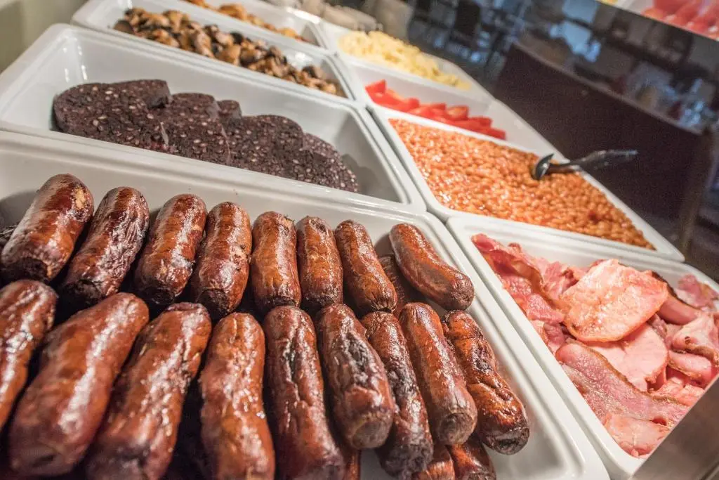 a display of different types of donuts and other foods at Nethybridge Hotel in Nethy Bridge