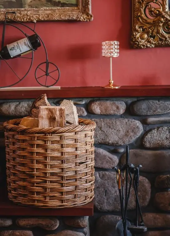 a basket on a table next to a brick wall at Boat Country Inn and Restaurant in Boat of Garten