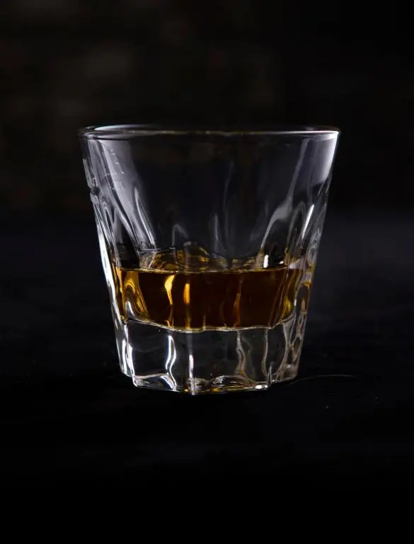 a glass of whiskey sitting on a table at Boat Country Inn and Restaurant in Boat of Garten