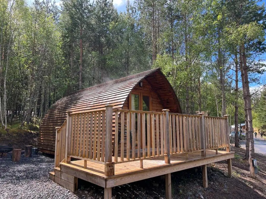 a small wooden cabin in the middle of a forest at Glenlivet by Wigwam Holidays in Tomintoul