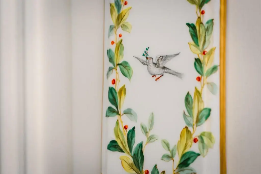 a picture of a bird flying in front of a wall at Dun Brae Cottage in Dornoch