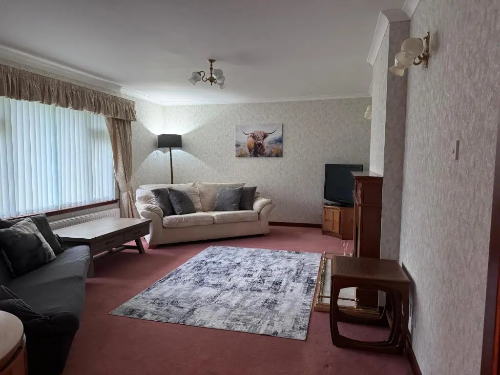 a living room with a couch and a tv at Oaklyn,Highland Village of Beauly, Quiet Neighbourhood, One Bed, Min 5 nights in Beauly