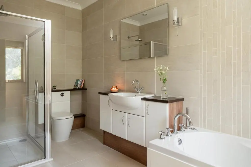 a bathroom with a sink and a tub and a toilet at Fairways - Seasgair Lodges in Nairn