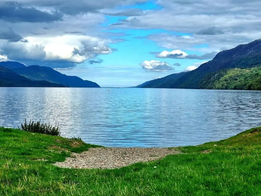 a view of a lake with mountains in the background at Heath House Loch Ness in Errogie