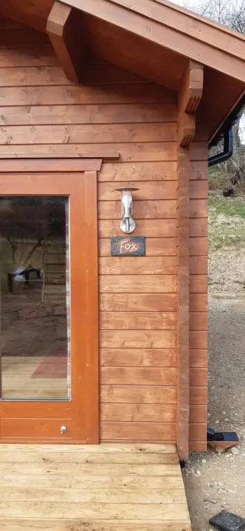 a wooden building with a door with a sign on it at Cobblehouse Country Cabins no TRADE WORKERS in Inverkeithny