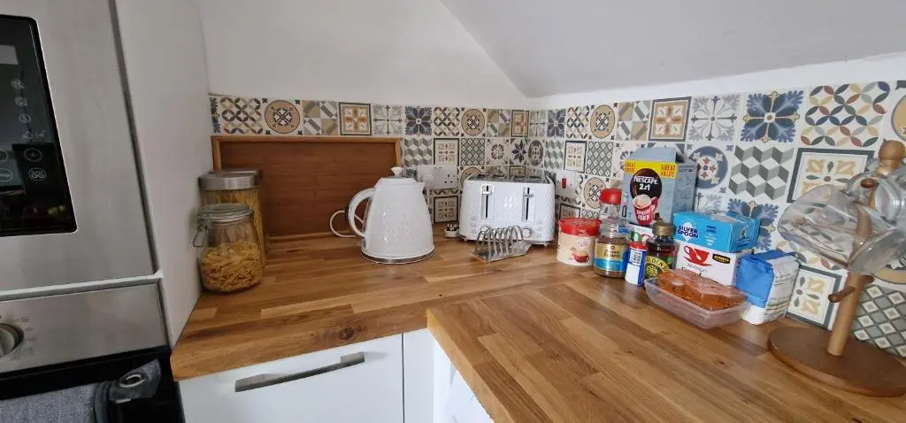 a kitchen with a counter top with food on it at The Flat at Clocktower Buildings in Kinloss
