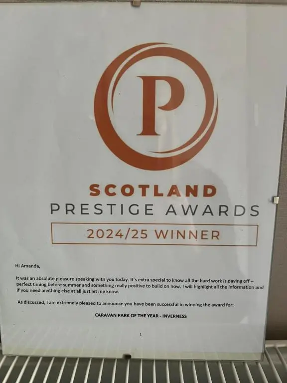 a sign for a scotlandnsicsnsicsnsicsnsicsnsics at 44 Angels Retreat in Boat of Garten