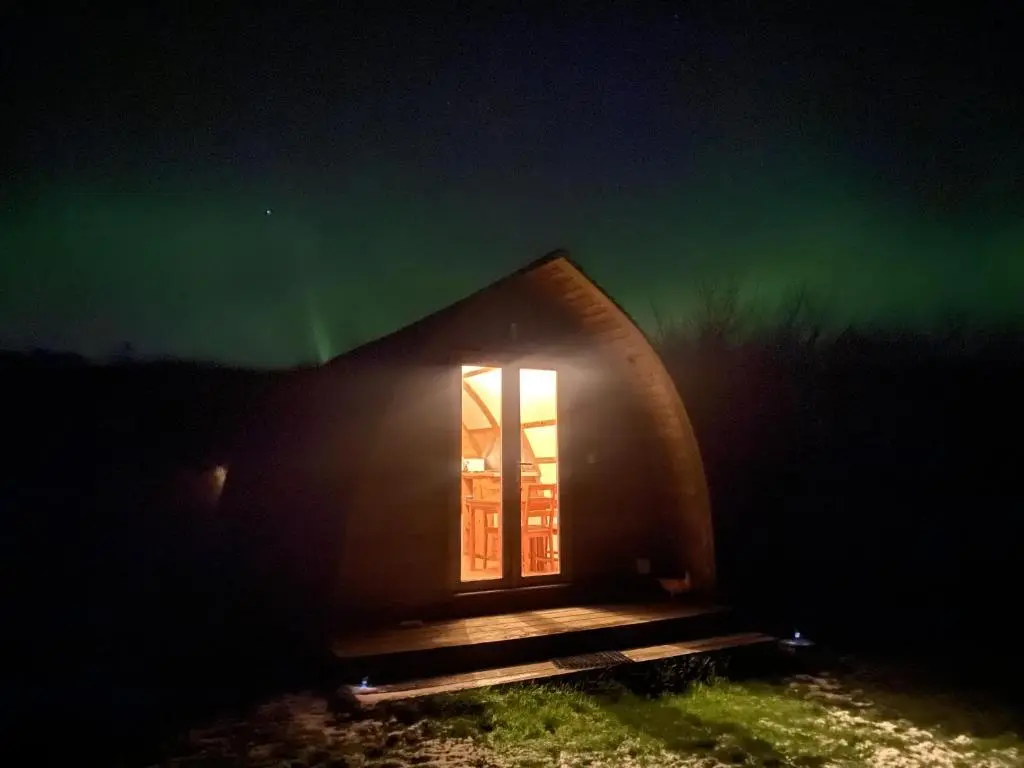 a room in a dome shaped building with a window at Greenley Croft Glamping by Wigwam in Crovie