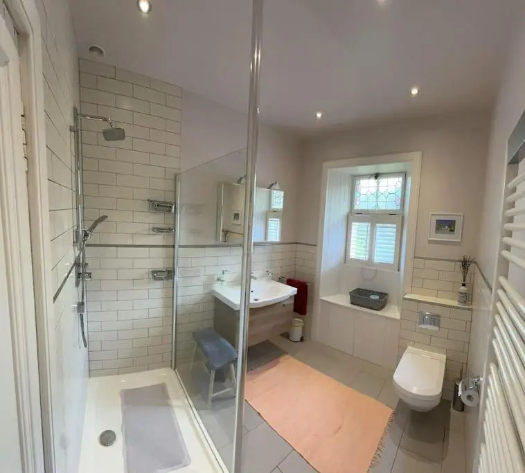a bathroom with a shower and a sink and a toilet at Victorian Home in Moray in Forres