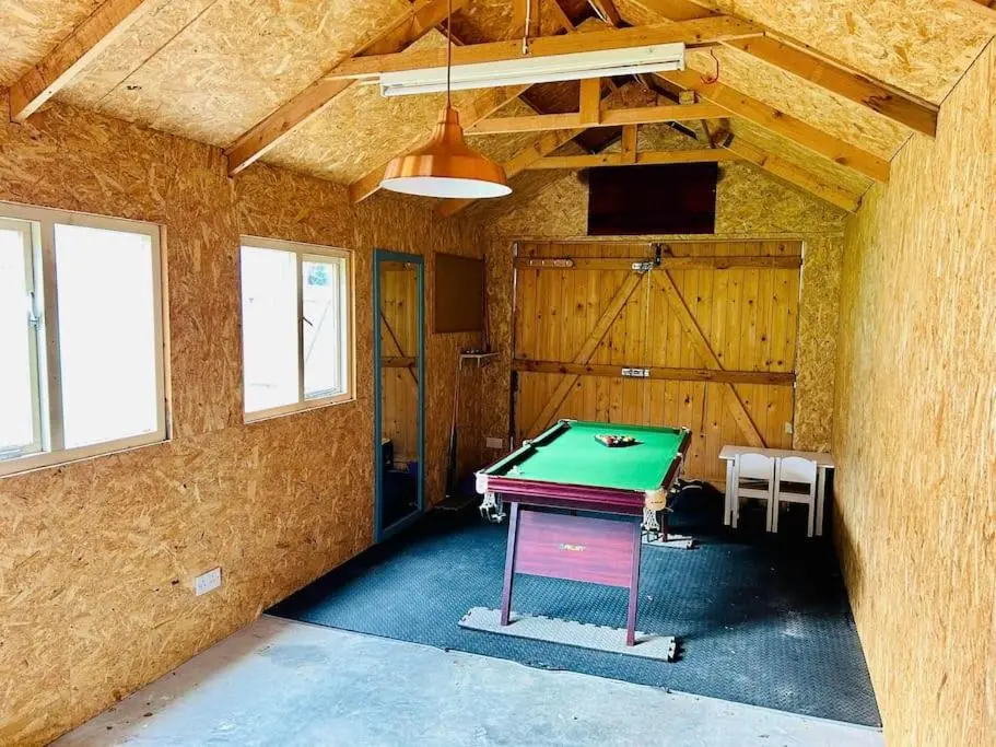 a room with a ping pong table in it at Victorian Home in Moray in Forres